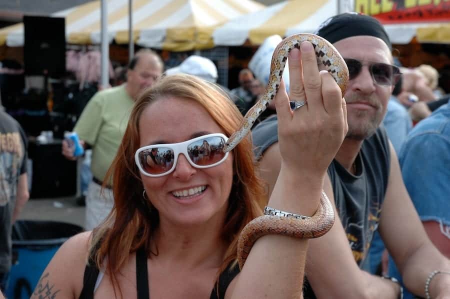 Woman with snake at Bike Week