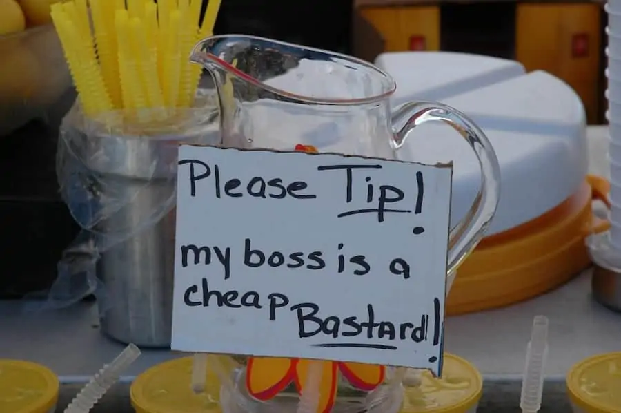 Sign on pitcher encouraging tips
