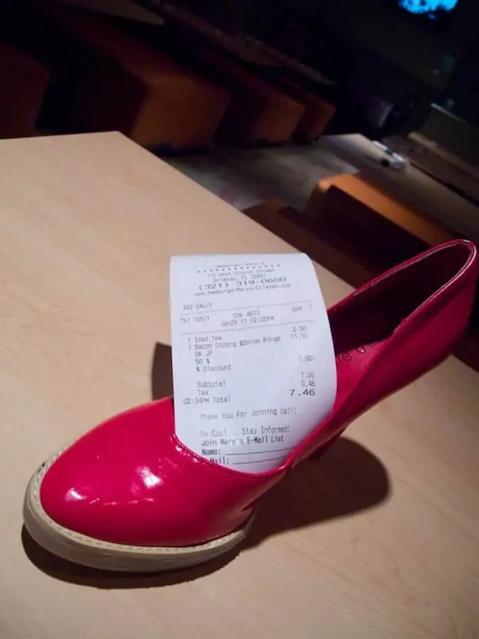 Hamburger Mary's guest check arrives in red high heel shoe